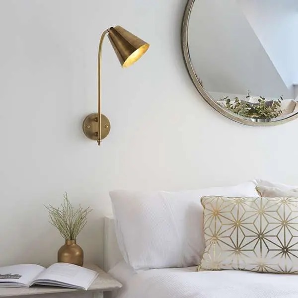 Radha Wall Light in Brass Finish