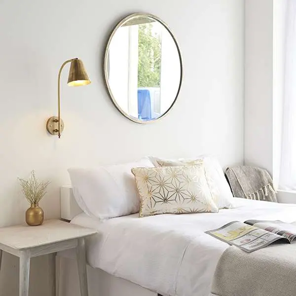 Radha Wall Light in Brass Finish